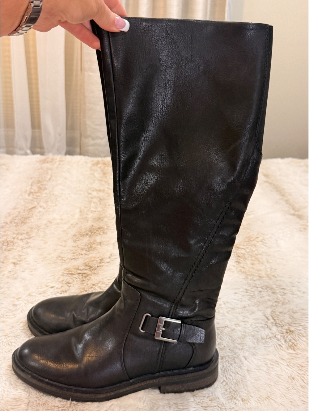 Black tall riding boots with buckle